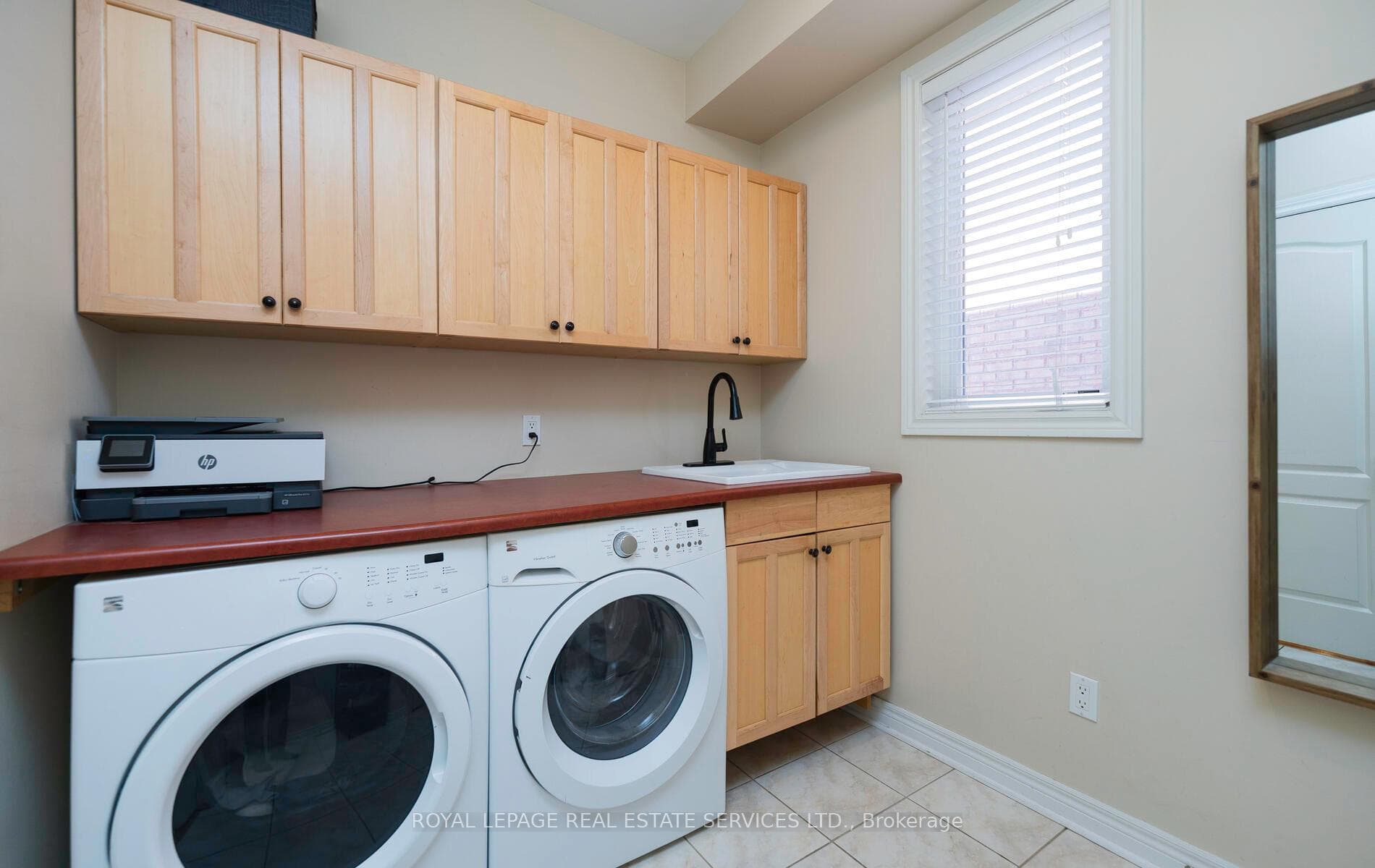Laundry rm, built in W/D, counter, cabinets, sink