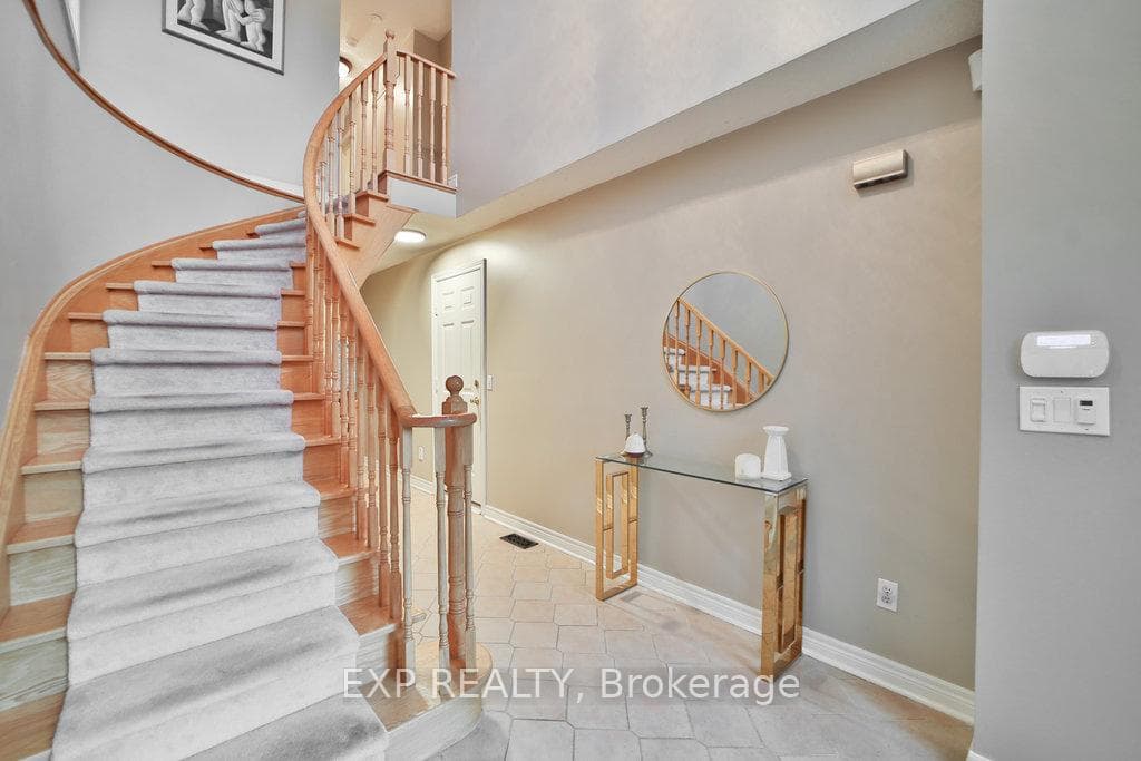 Elegant open stairwell to second floo