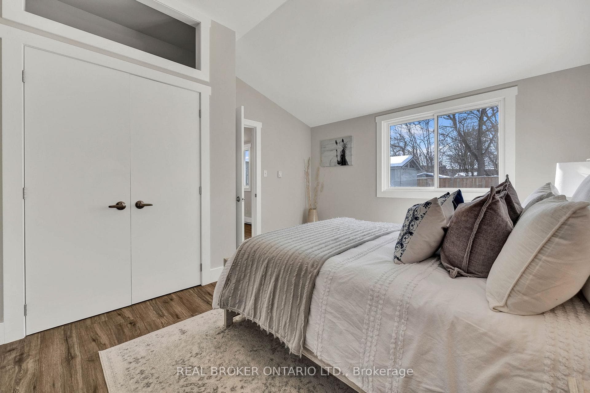Large primary bedroom, vaulted ceiling, closet