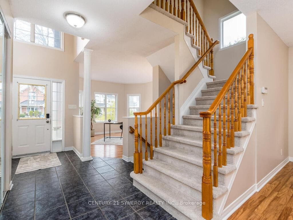 Bright front foyer with lovely big windows.
