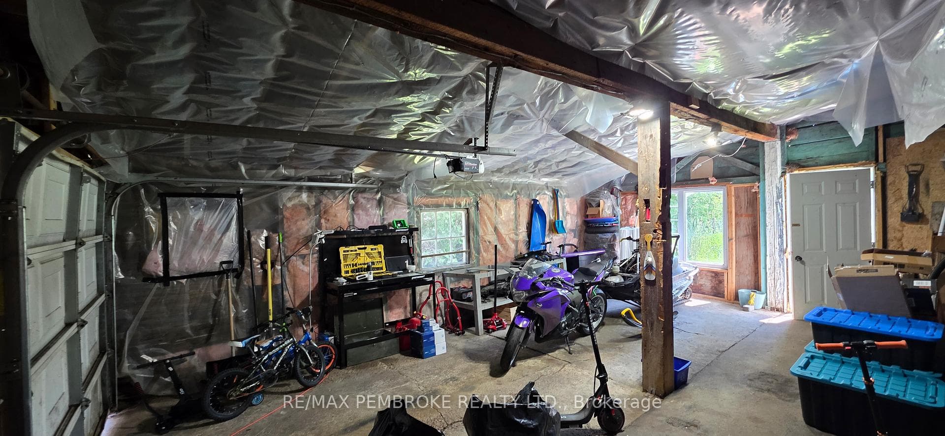 Inside garage with access to back yard & addition