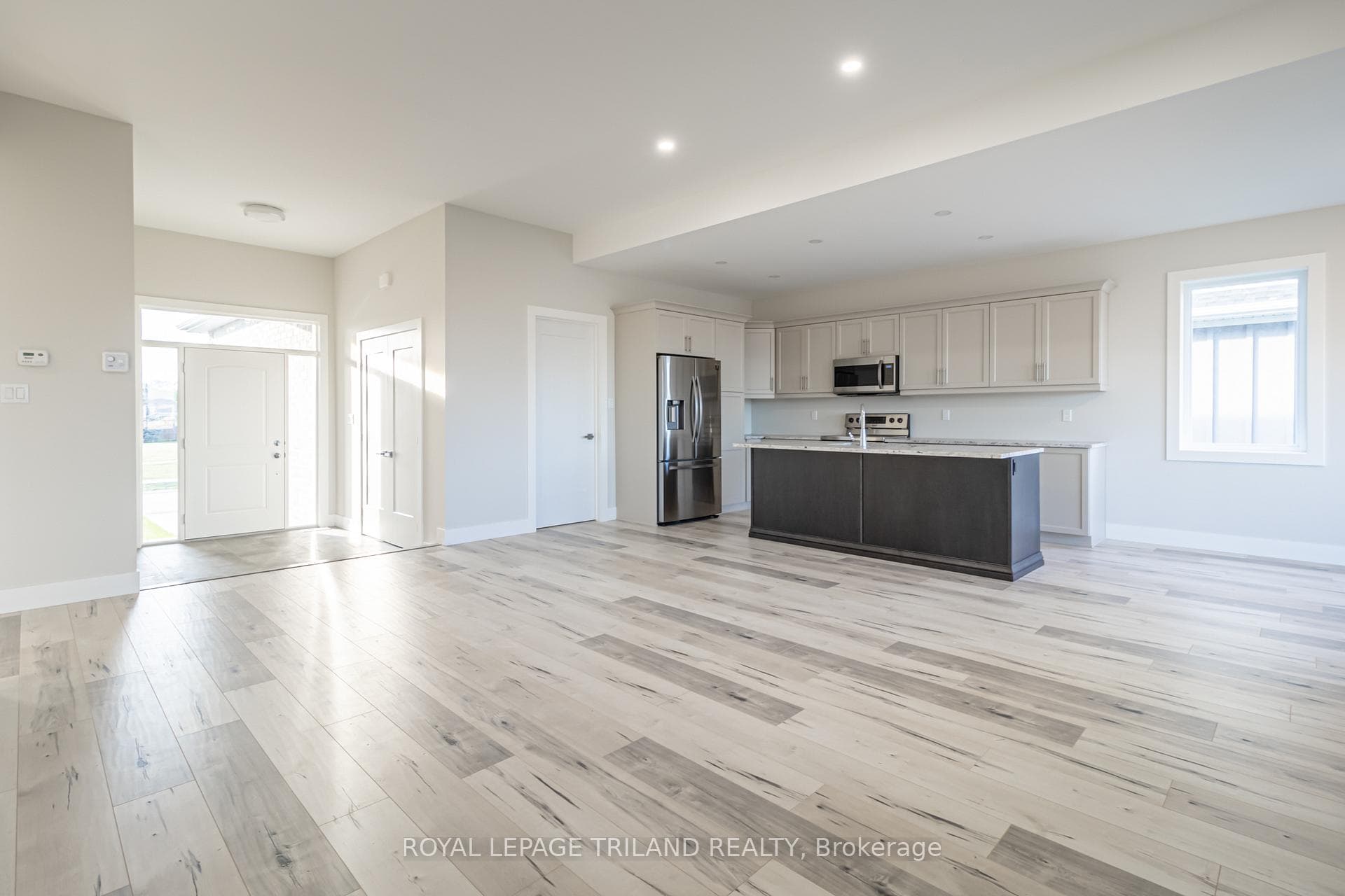 Foyer leads to large & bright open living space