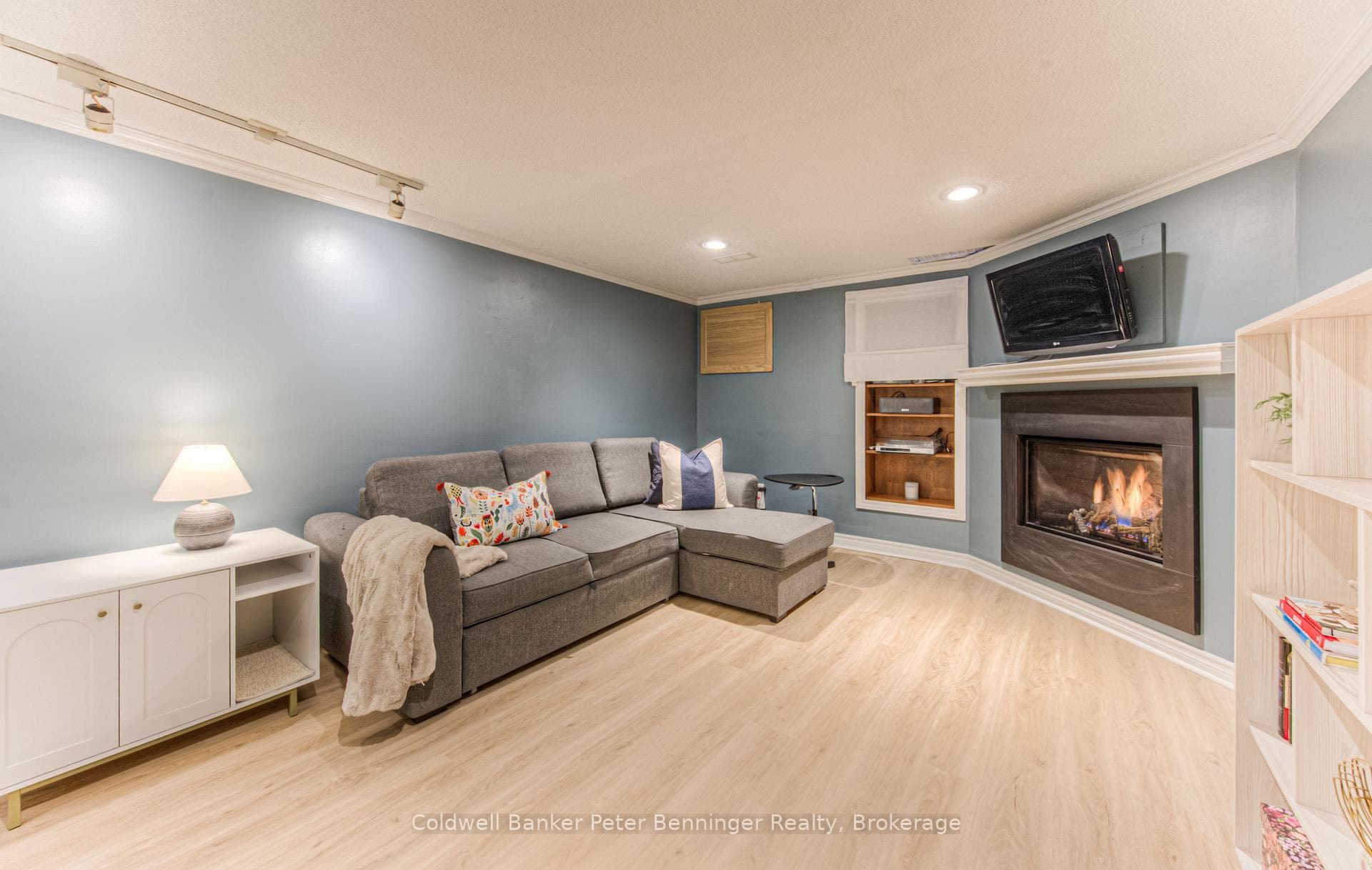 Rec room with gas fireplace in basement.