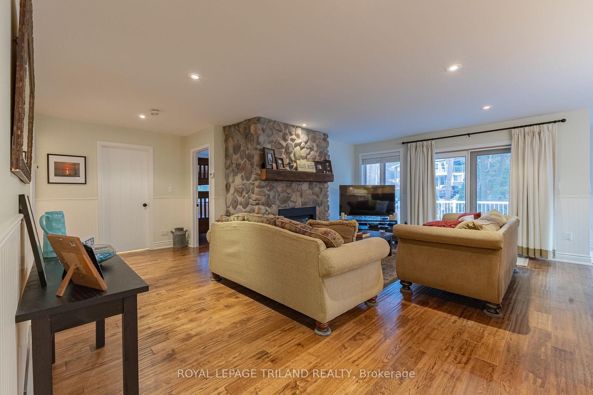Generous open concept main level w/ gas fireplace