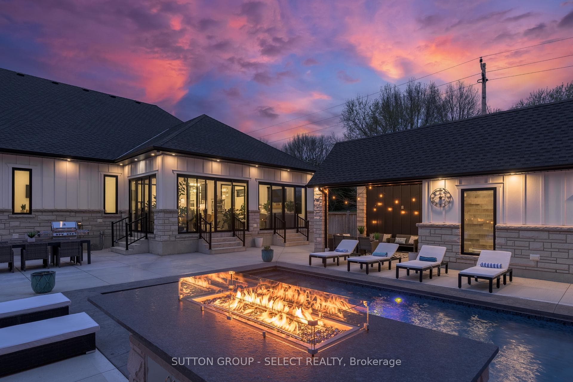 Evening with waterfall and fire feature