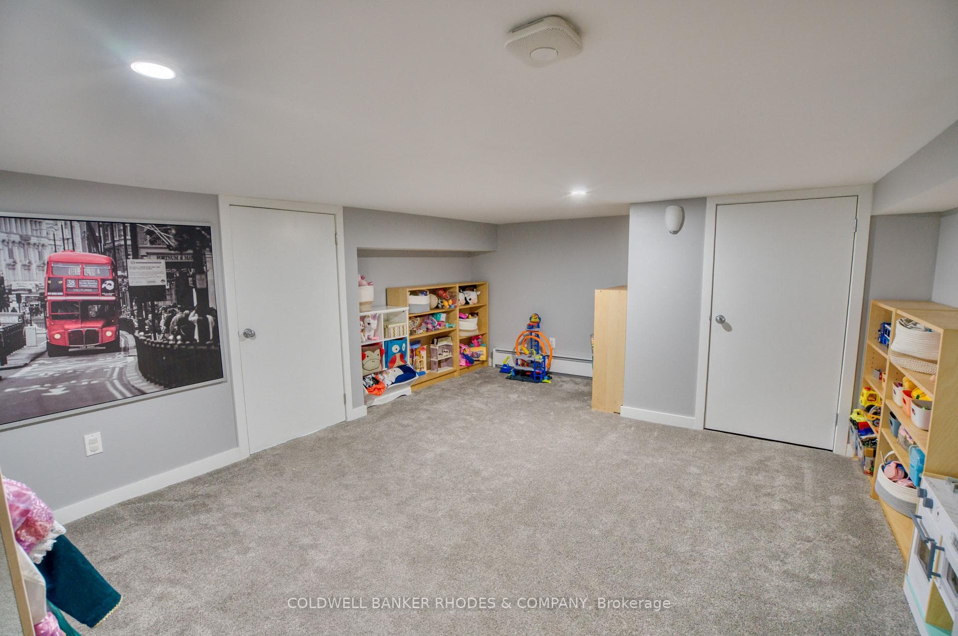 Basement playroom which opens to storage room
