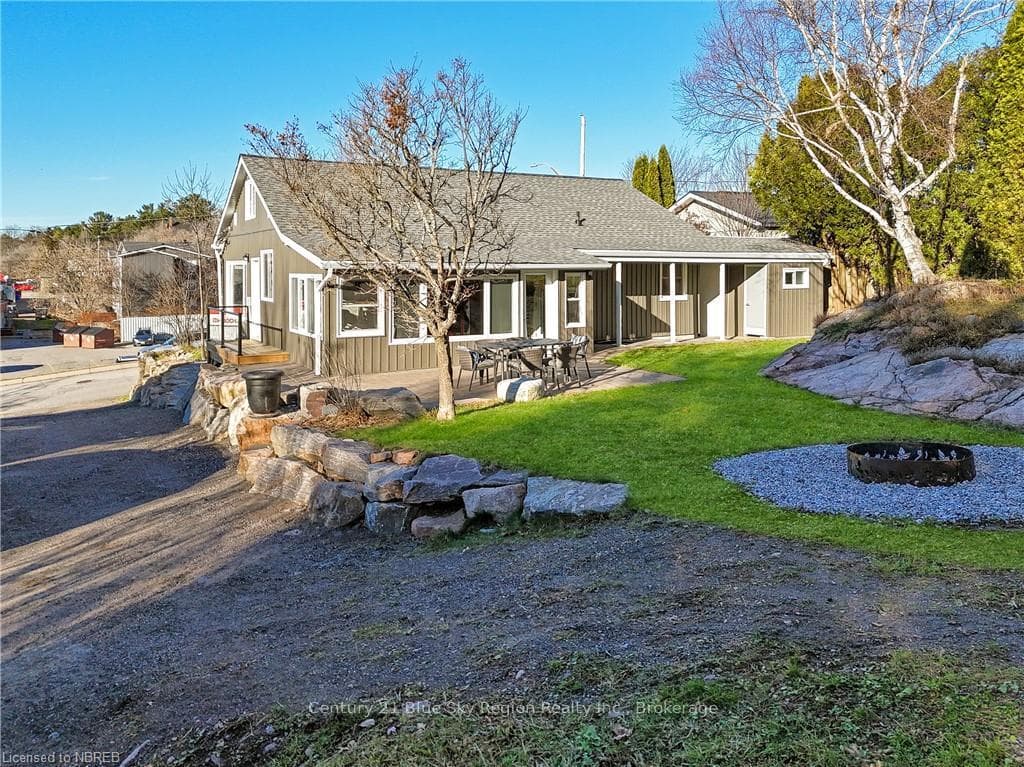Back of house featuring a patio area and a yard