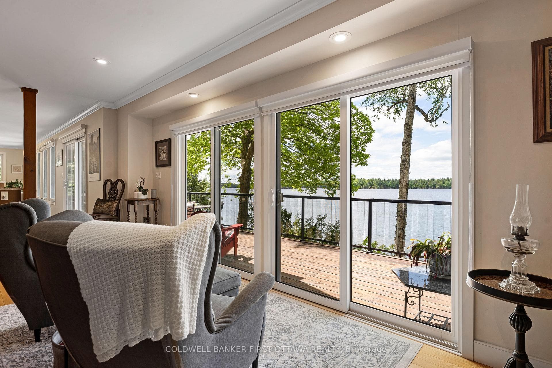 Patio doors offer panoramic views of Otty Lake