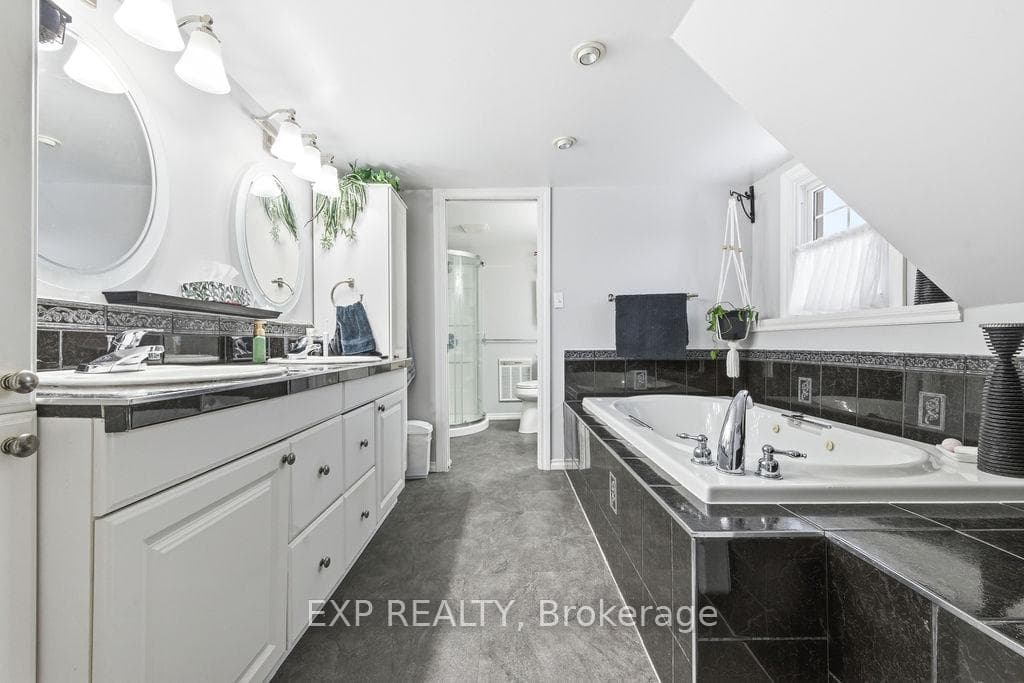 Second floor bath with double sinks, jacuzzi tub