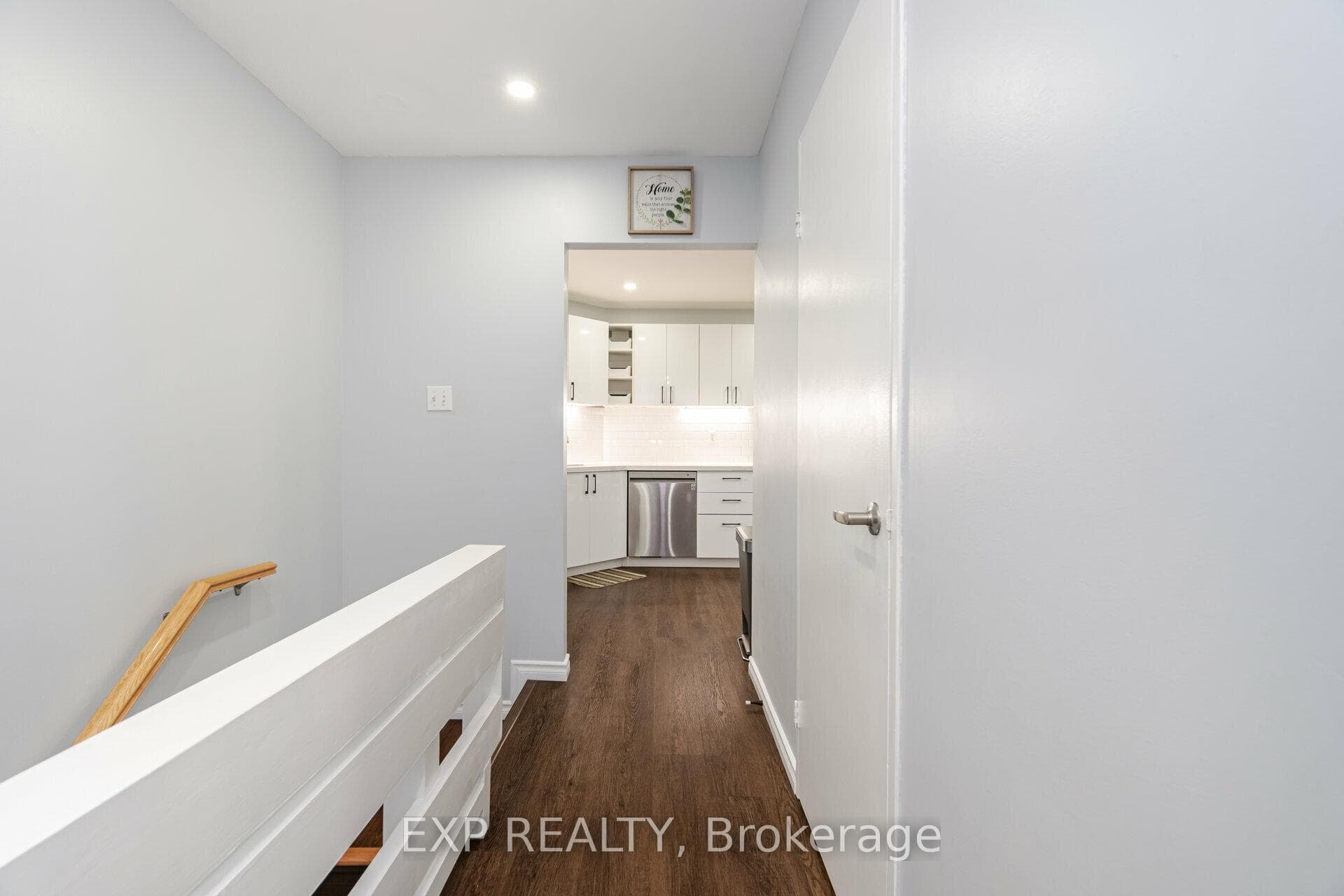Main floor foyer with stairs leads to lower level.