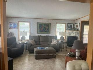 Bright livingroom with gas fireplace