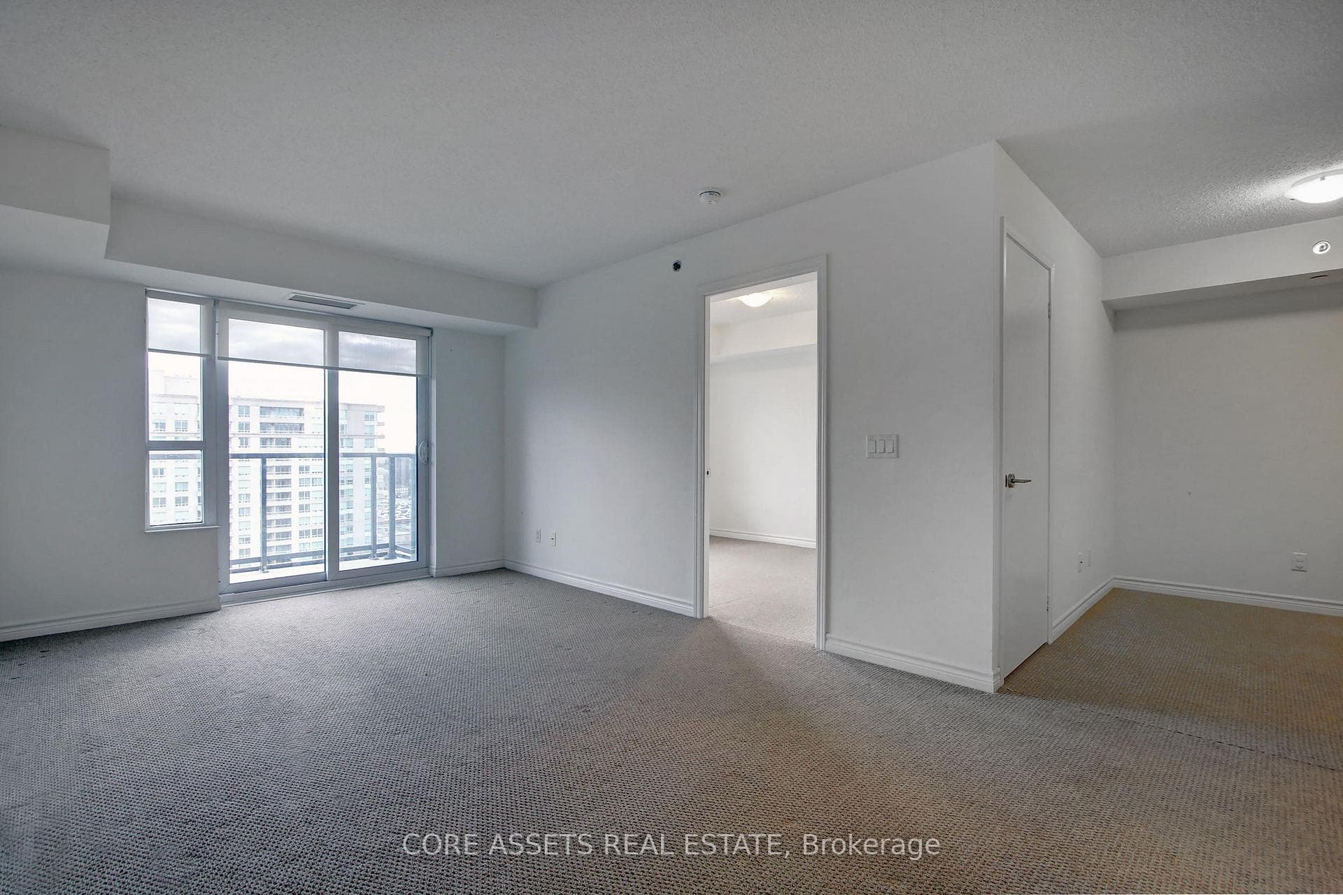 Living area showing second bedroom and den