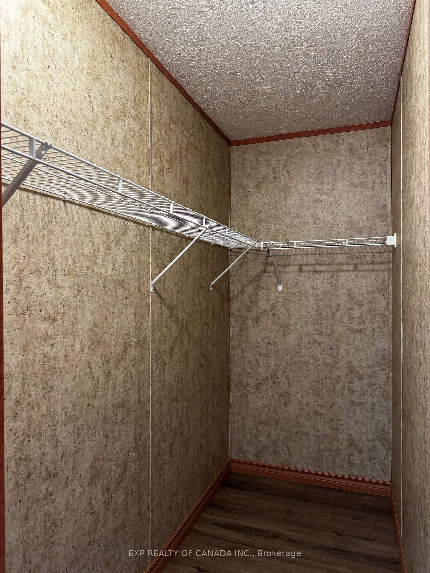 Walk in closet in primary bedroom