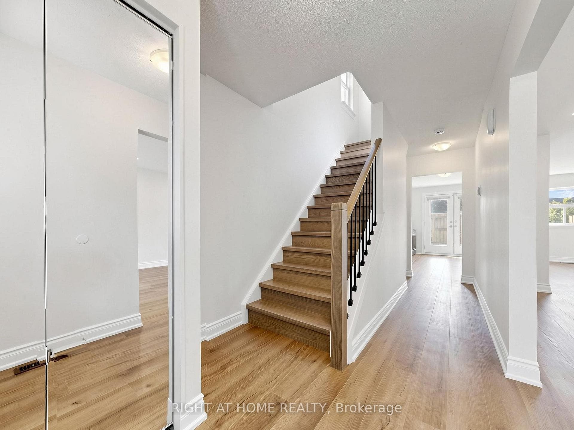 Entryway - hallway, mirrored closet and stairs