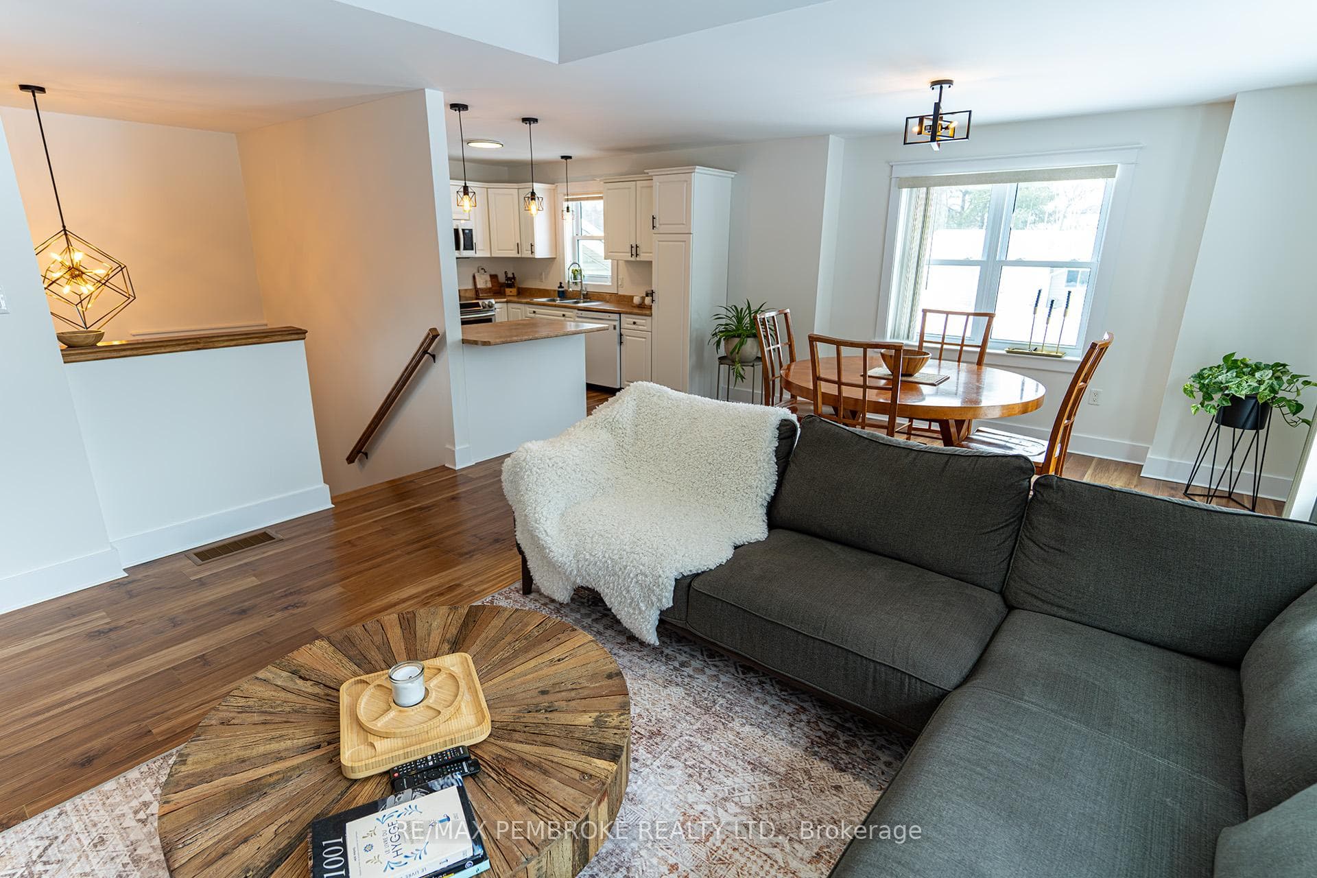 living room with tray ceiling & recessed lighting
