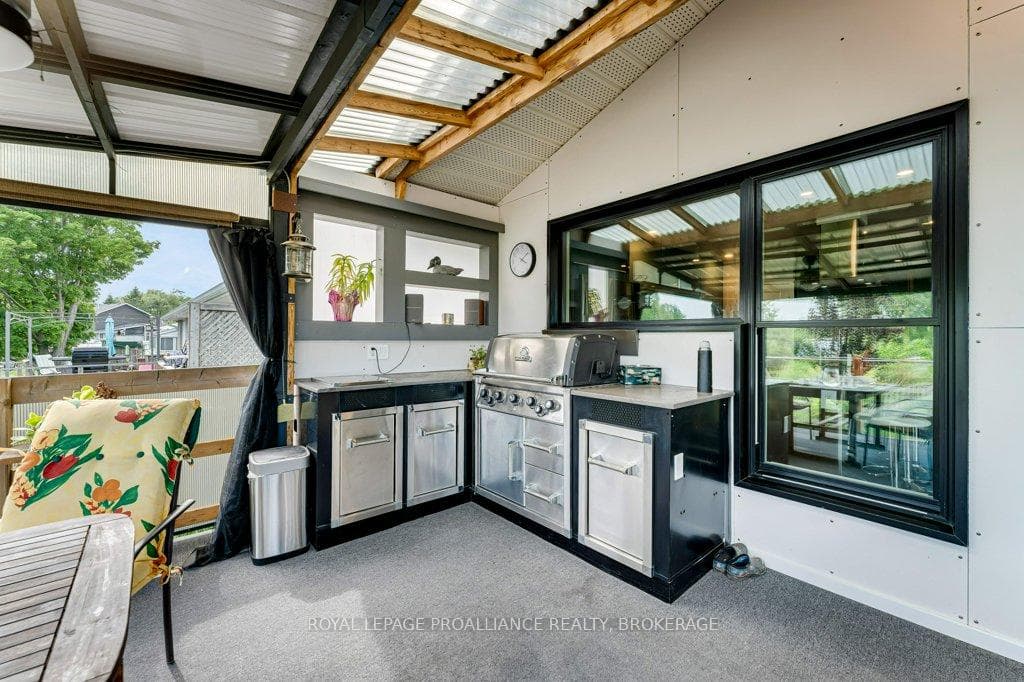Deck off Kitchen with outdoor cooking centre.