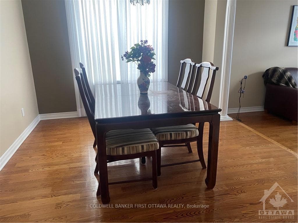 Dining room with hardwood flooring