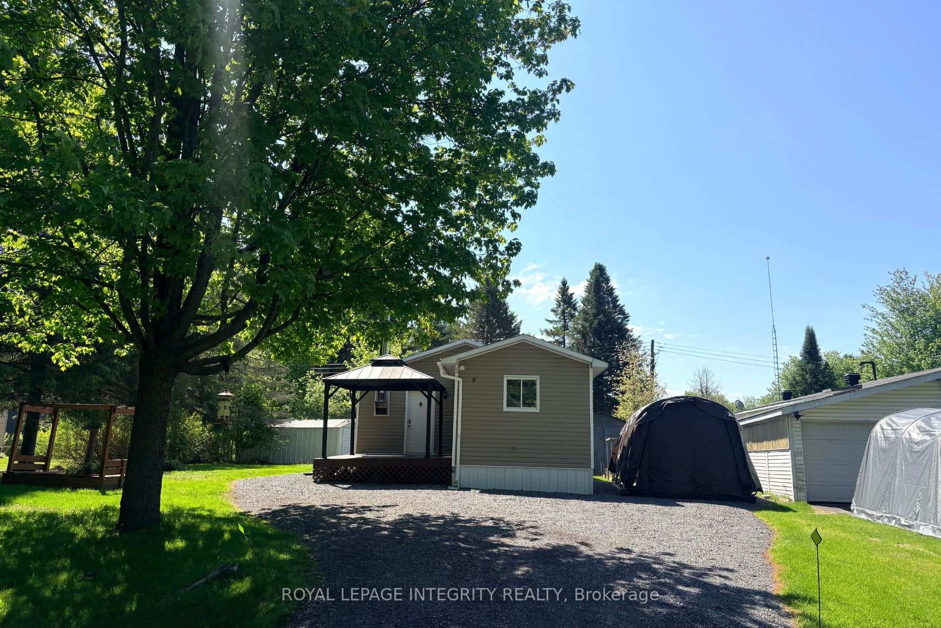 Wide driveway and mature trees