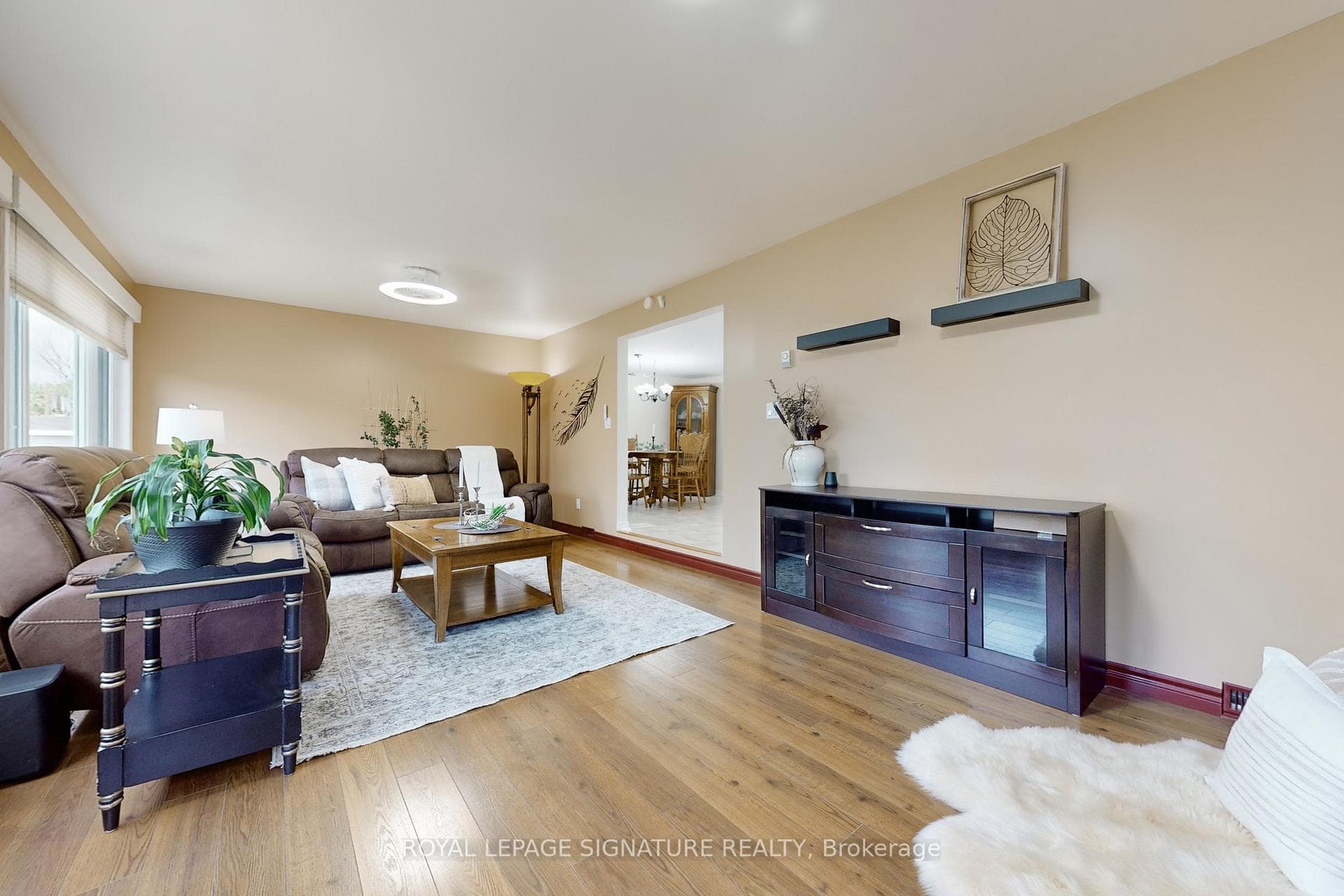 Family Room has Hardwood Floors & Large Windows