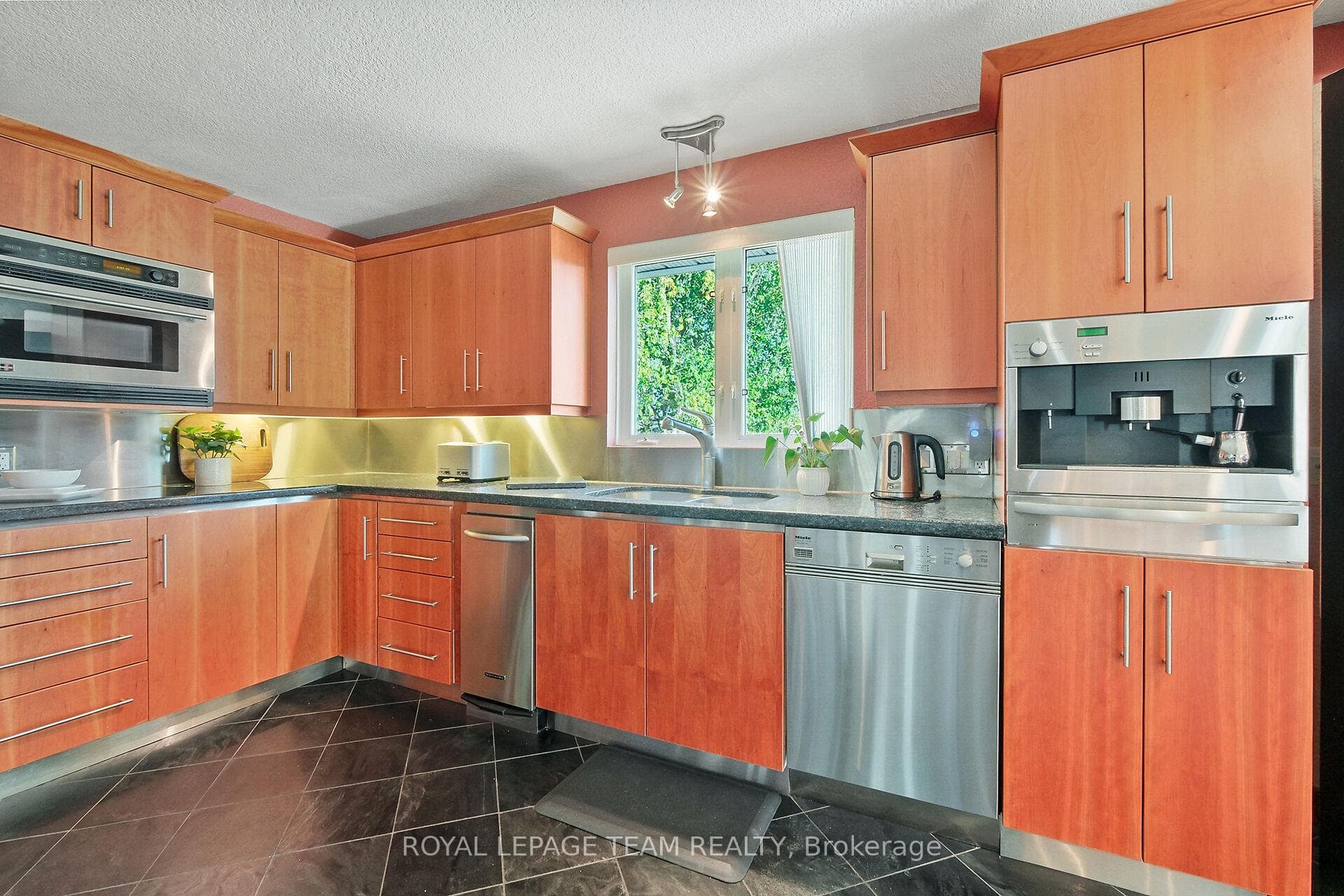 Custom built in stainless appliances.