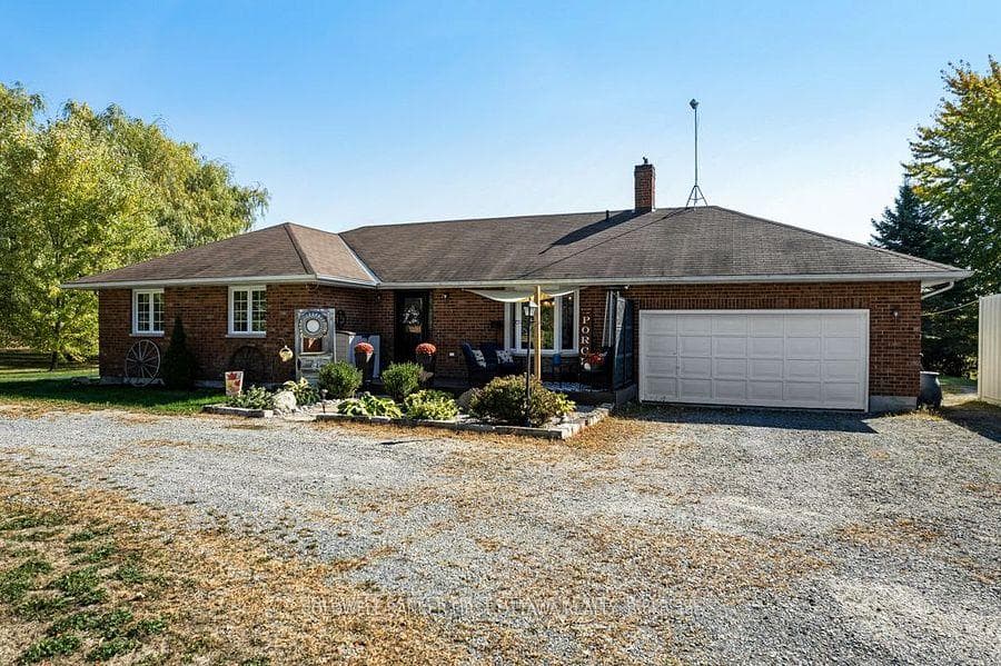Summer view of bungalow with curb appeal