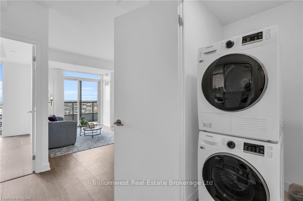 Washroom with hardwood / wood-style flooring and s