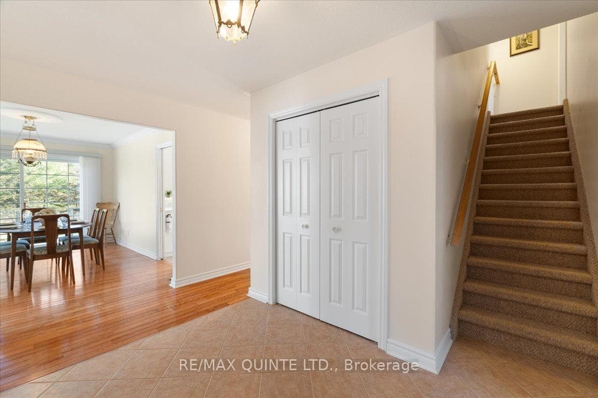 foyer to living/dining area and stairs to loft