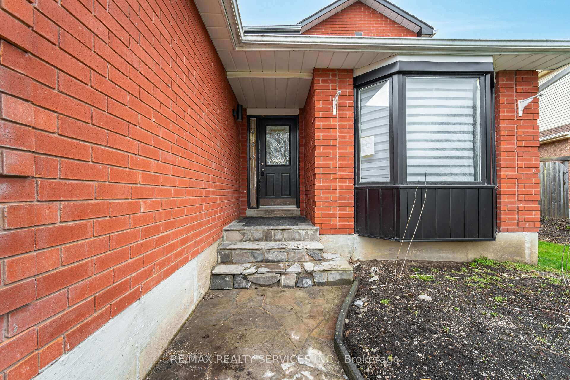 Modern Exterior With Stone Walkway