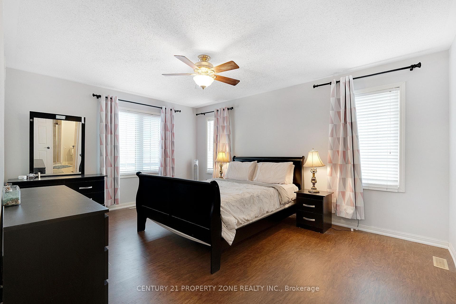 Sun-Filled Bedroom With Hardwood Floors