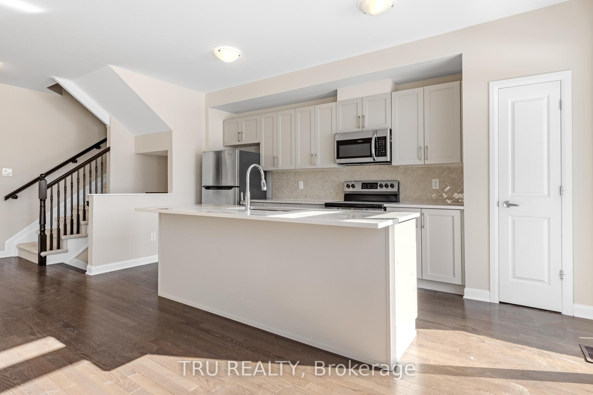 Open concept kitchen with quartz countertop