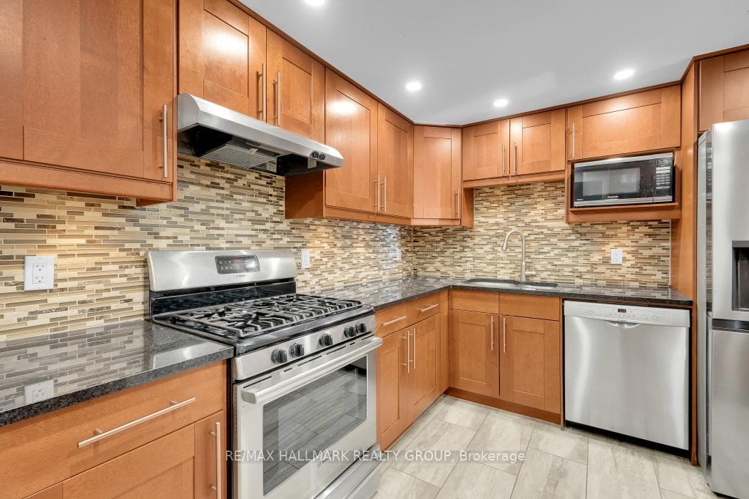 Stainless steel appliances including gas range.
