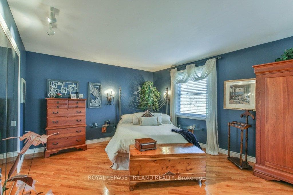 Large primary bedroom that fits a king sized bed.