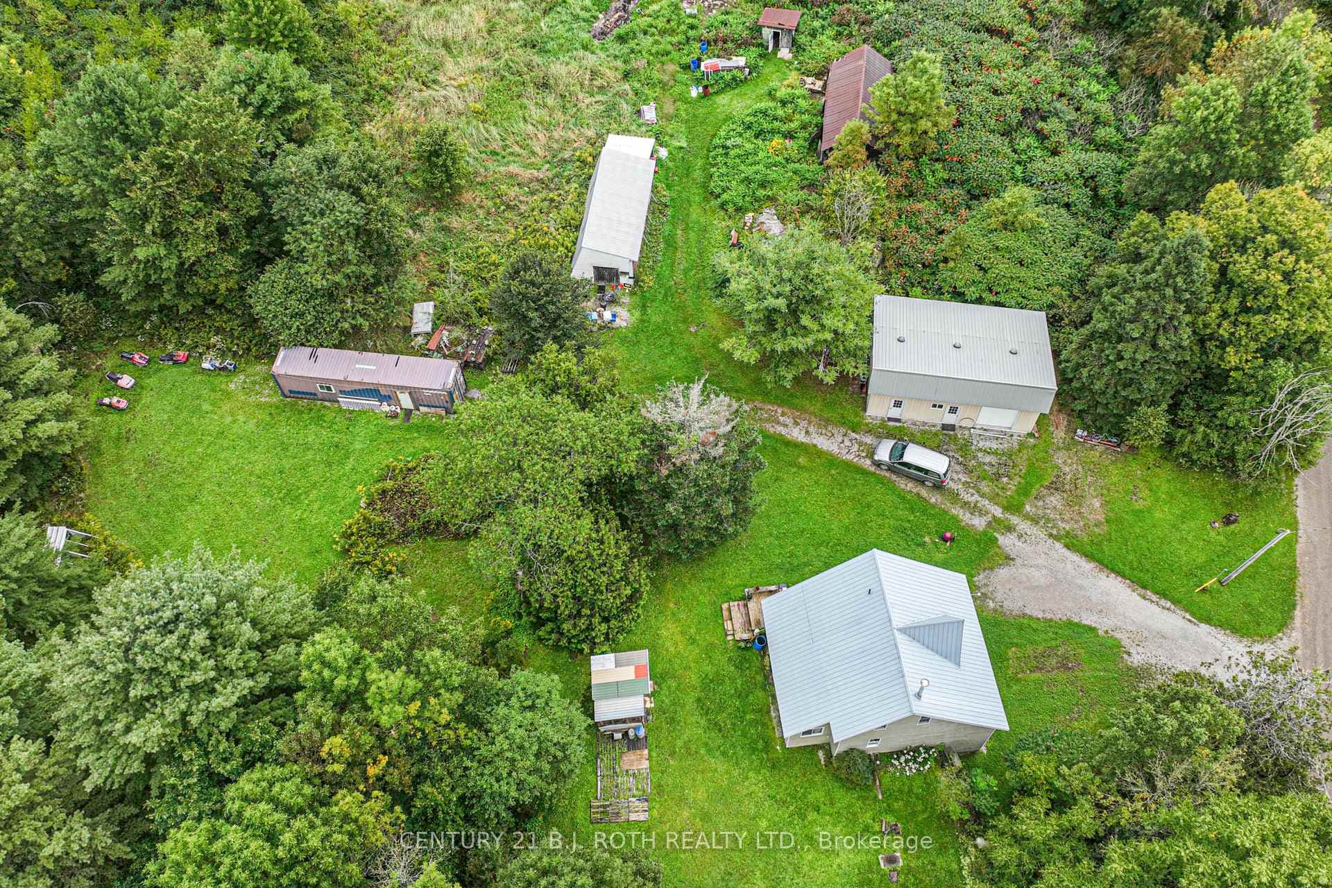 Over 3 acres with multiple outbuildings
