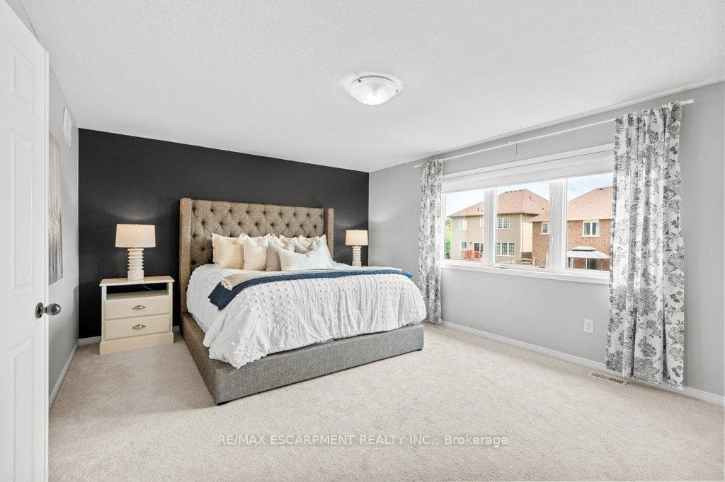 Large primary bedroom with beautiful windows!