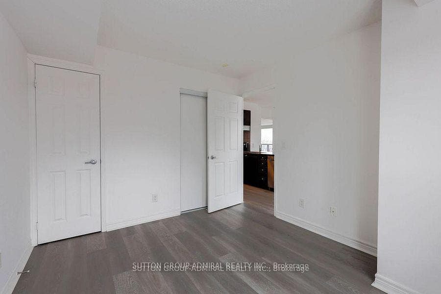 Different view of second bedroom double-closet