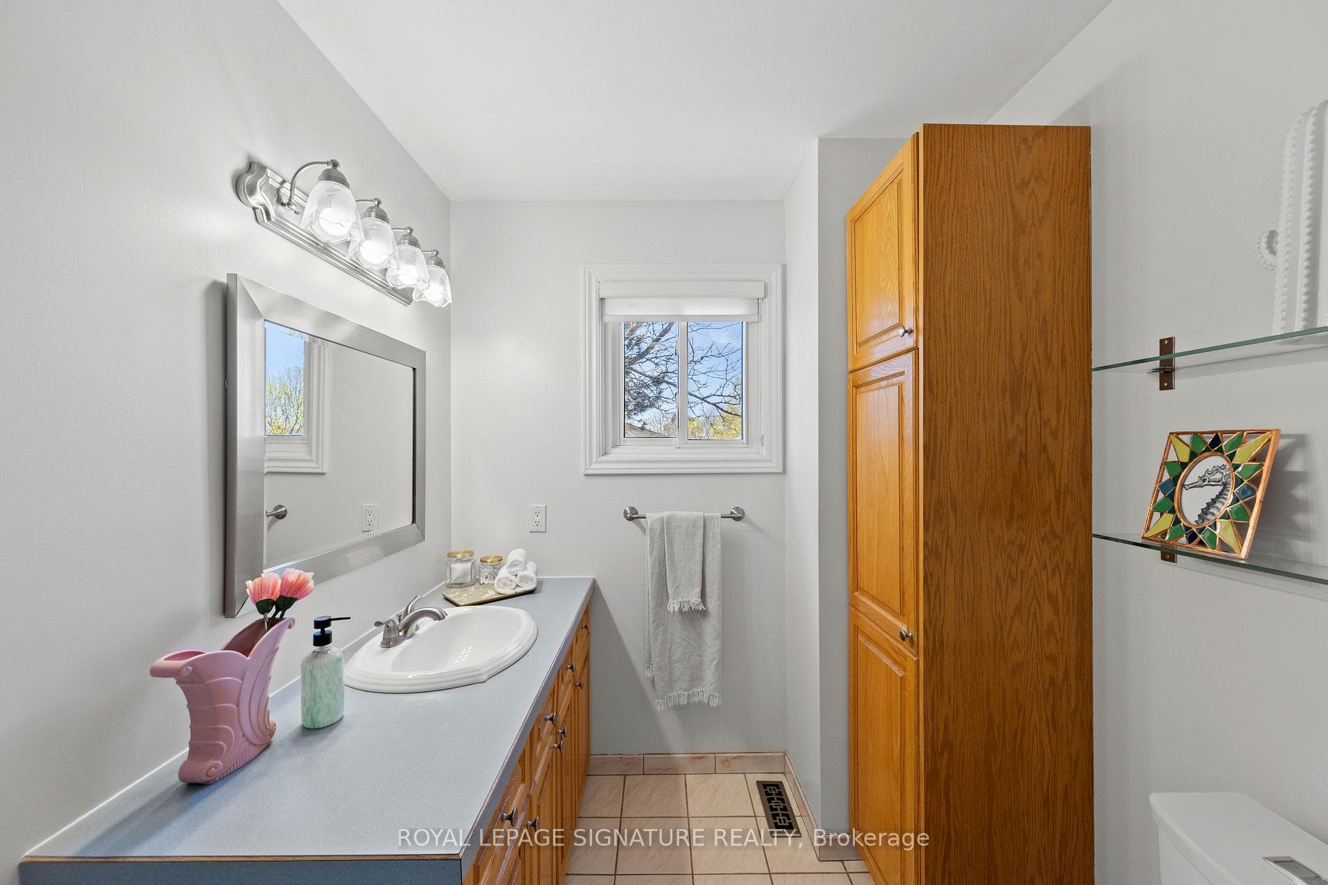 Large vanity and lots of storage/window faces BY