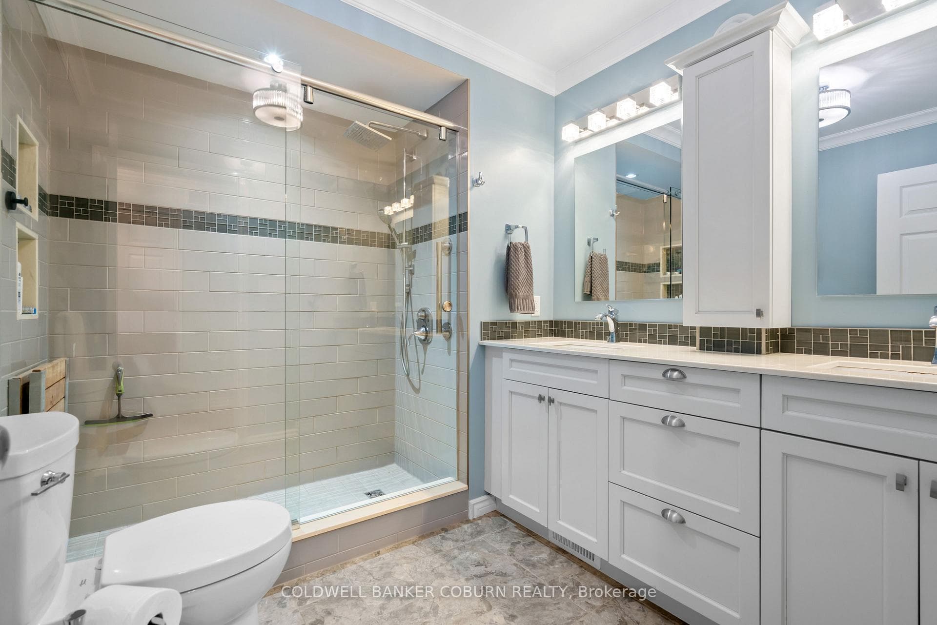 main bath with walk in shower, double sink vanity