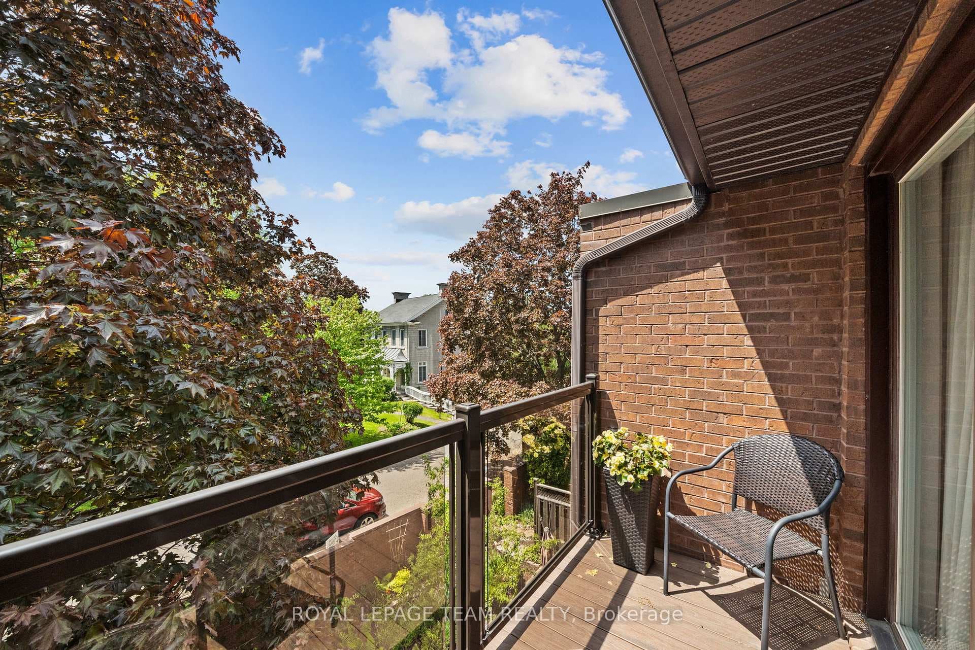 Balcony overlooking garden + heritage stone hous