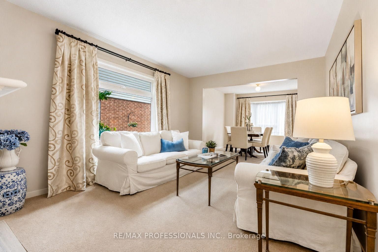 Living Room with Large Window Overlooks Side Yard