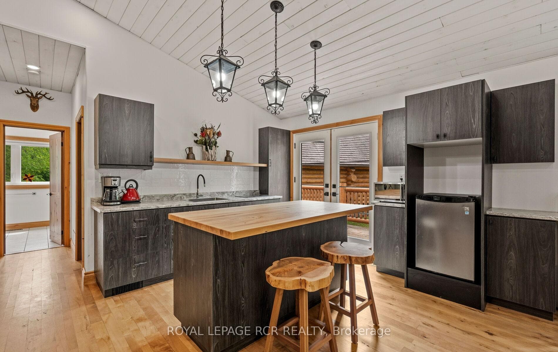 Kitchen has walkout to bridge