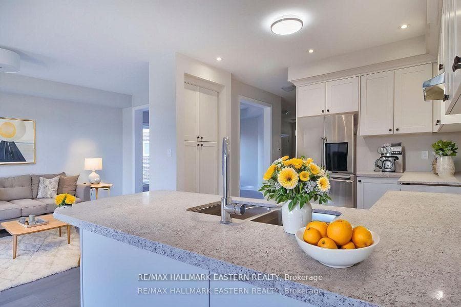 Quartz countered kitchen with pantry cabintry