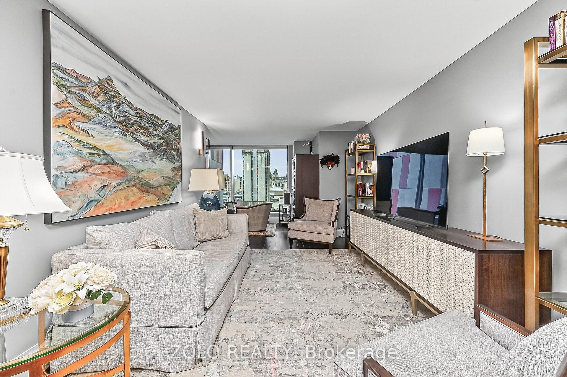 Wall to ceiling windows bring light to living room
