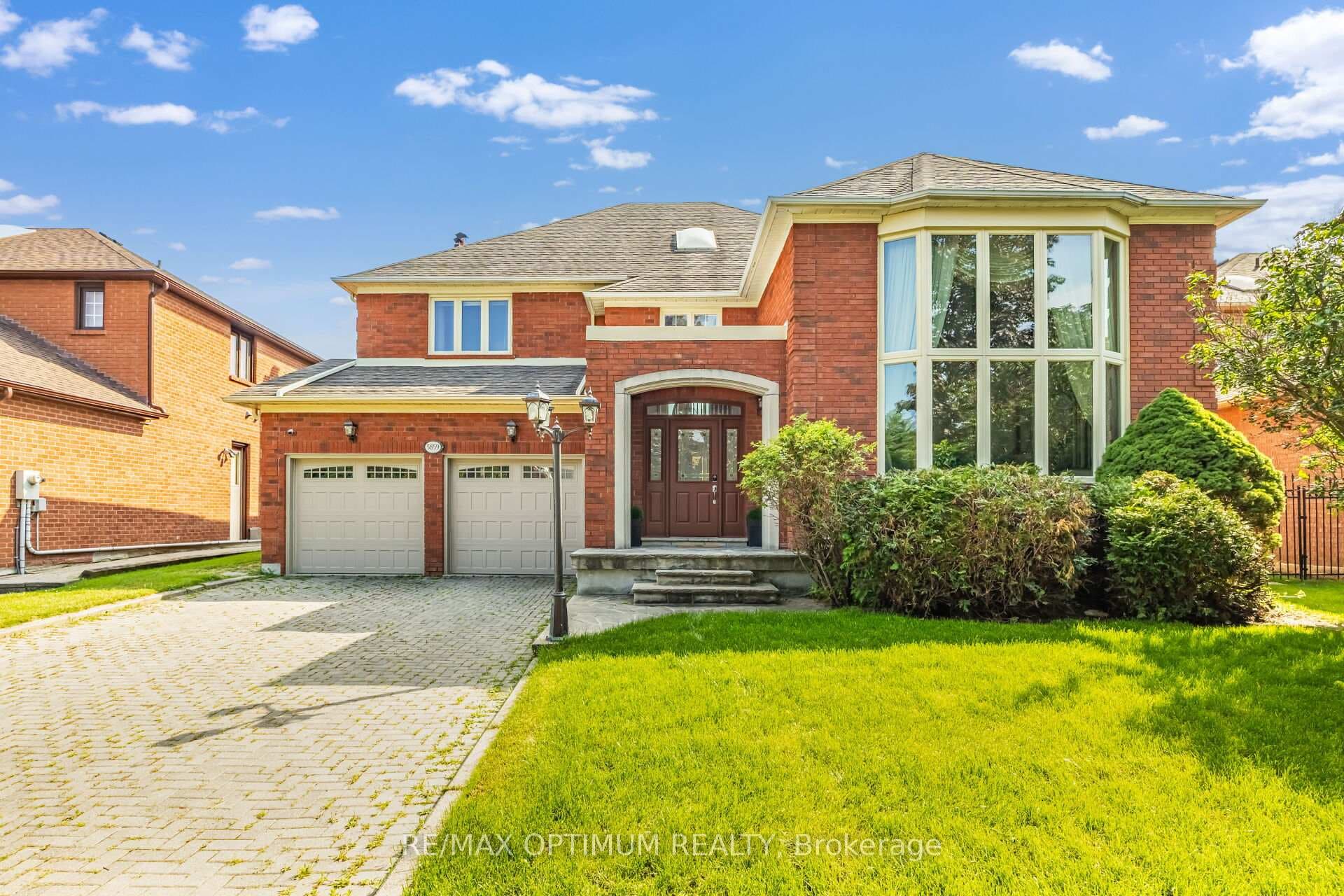 Stately brick exterior with bay windows