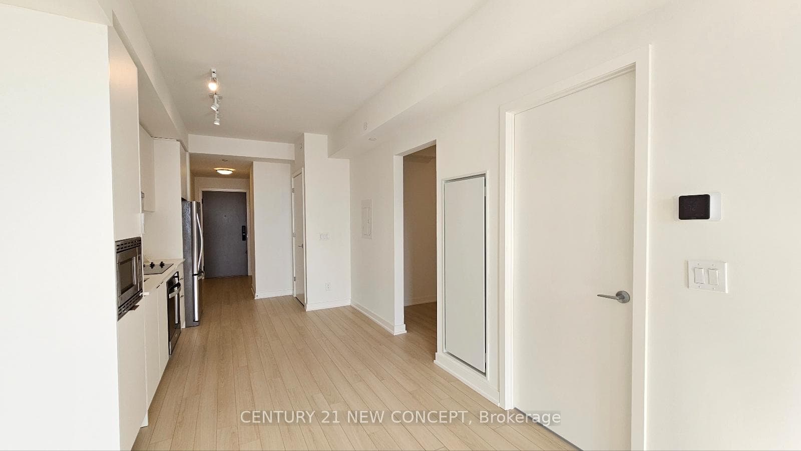 Kitchen opens to hallway and entry