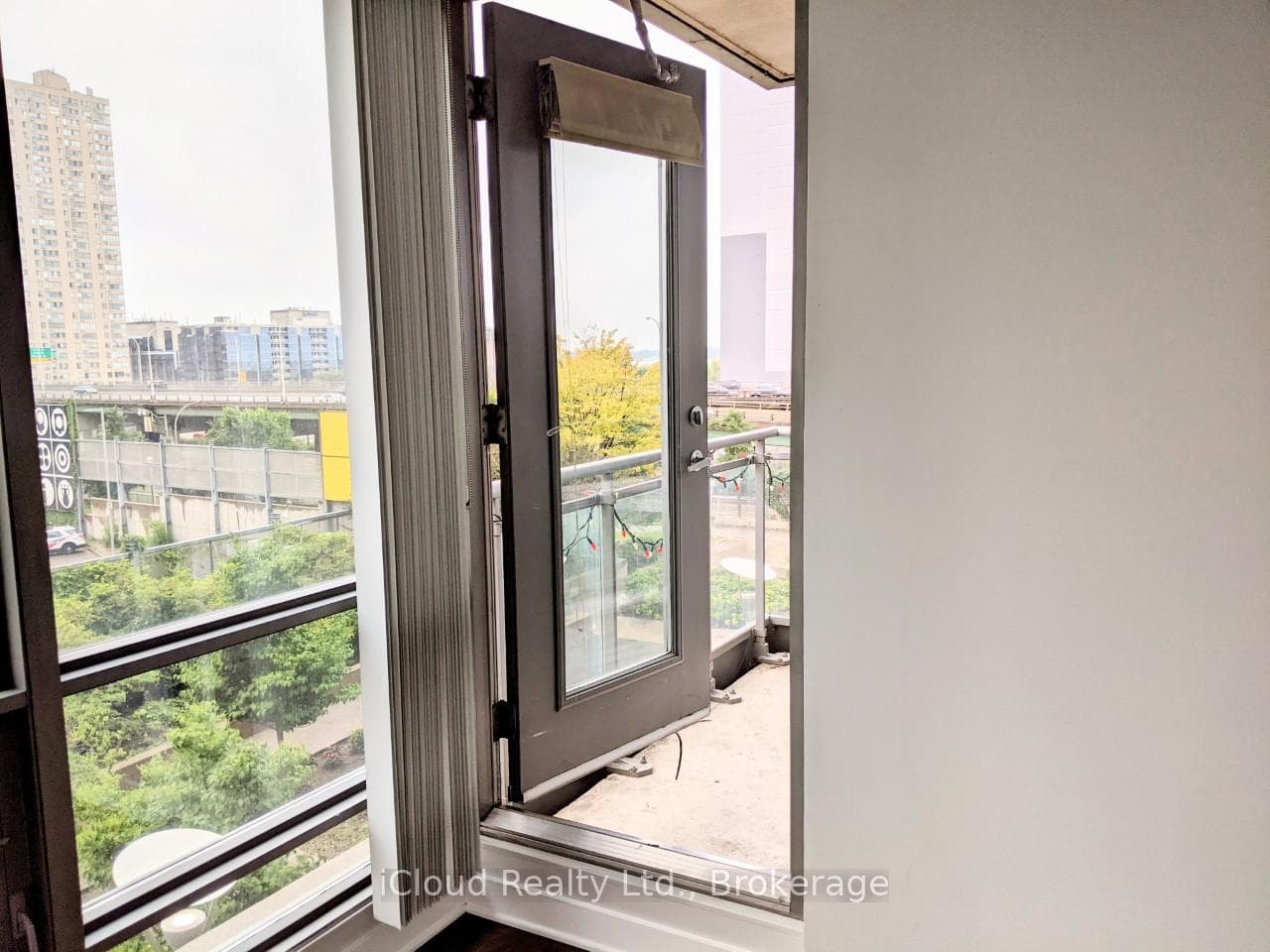 Door to Open Balcony with Partial Lake View