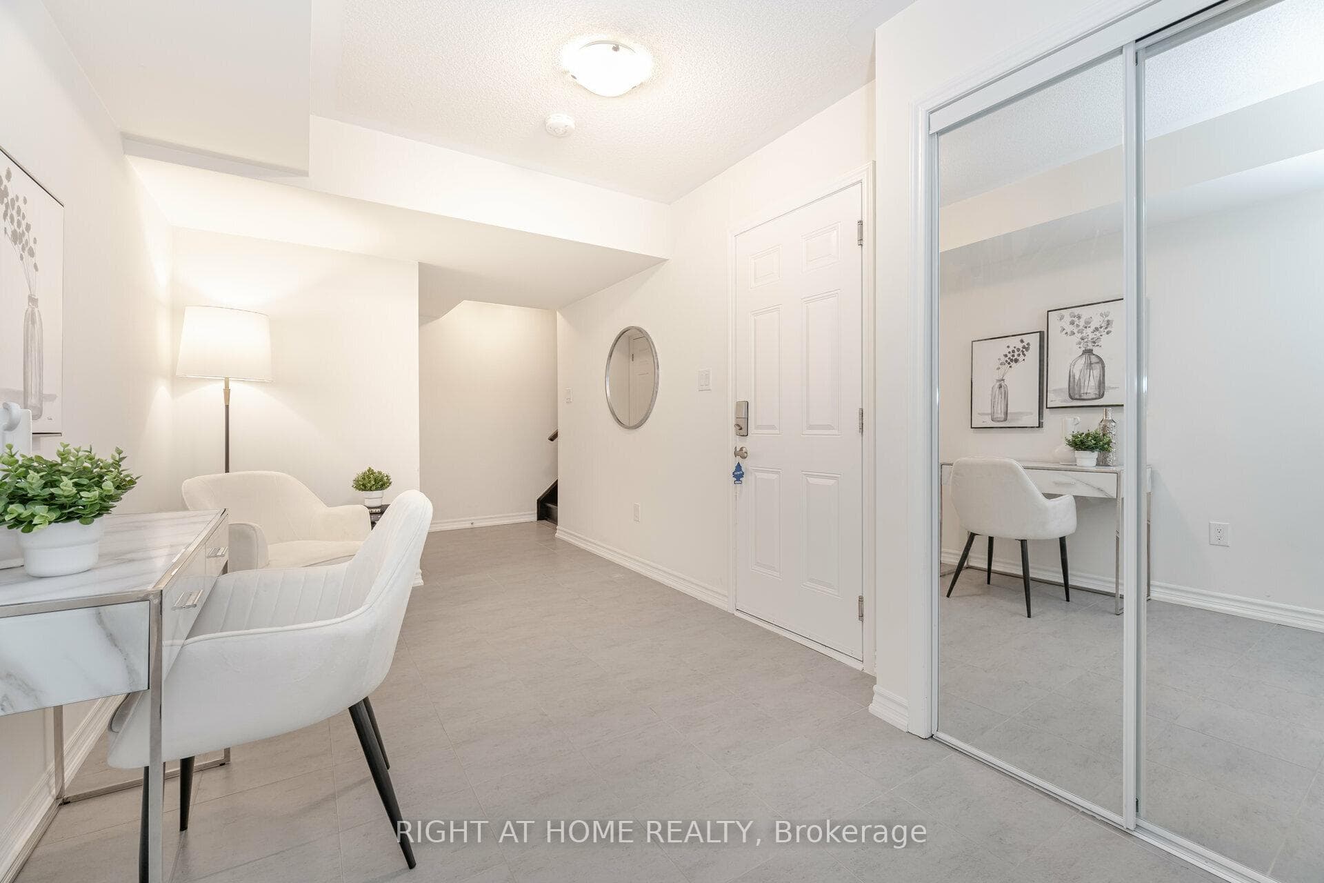 Large Foyer With Mirrored Closets & Garage Access