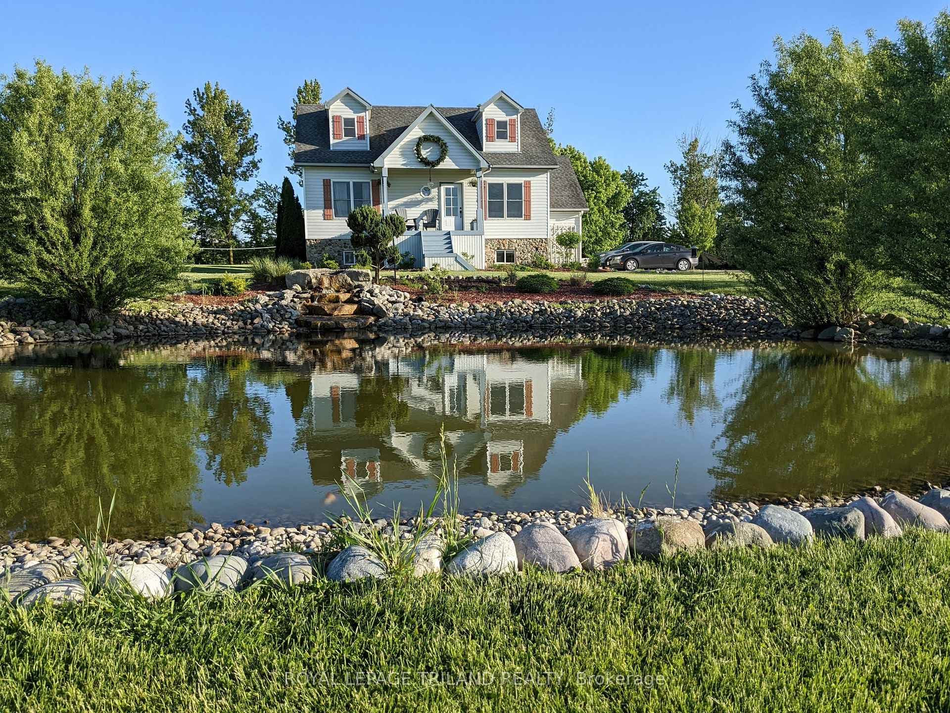 Stunning pond reflections & charming curb appeal