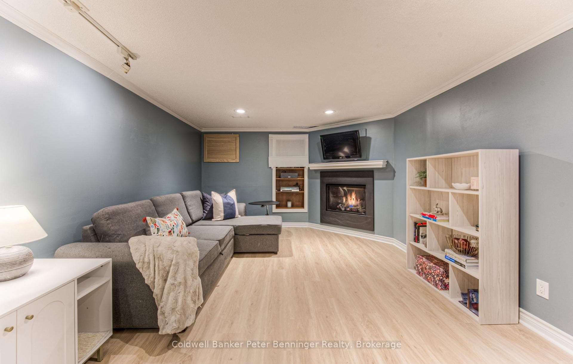 Rec room with gas fireplace in basement.