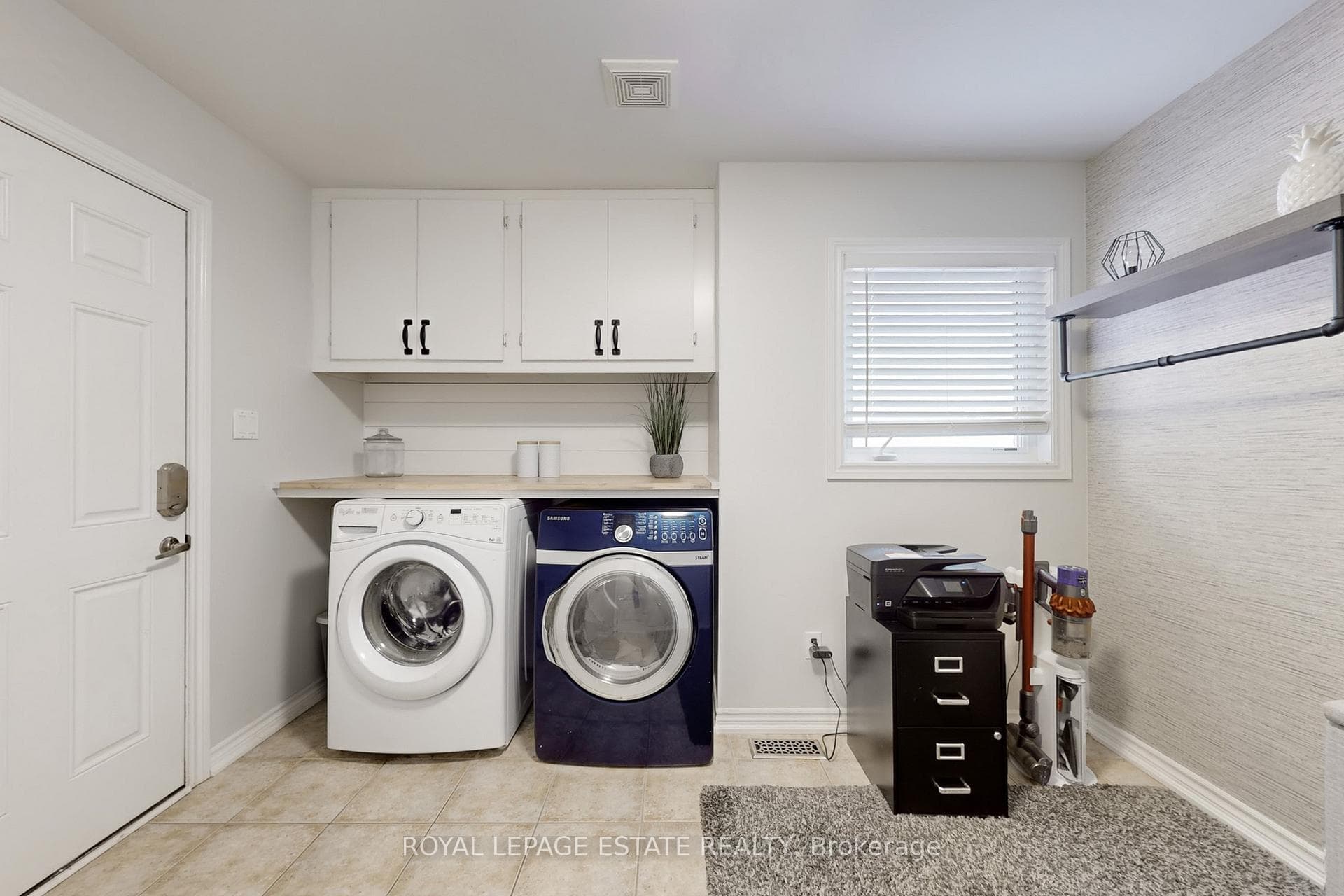 Separate laundry room w/ sink & walkout to garage