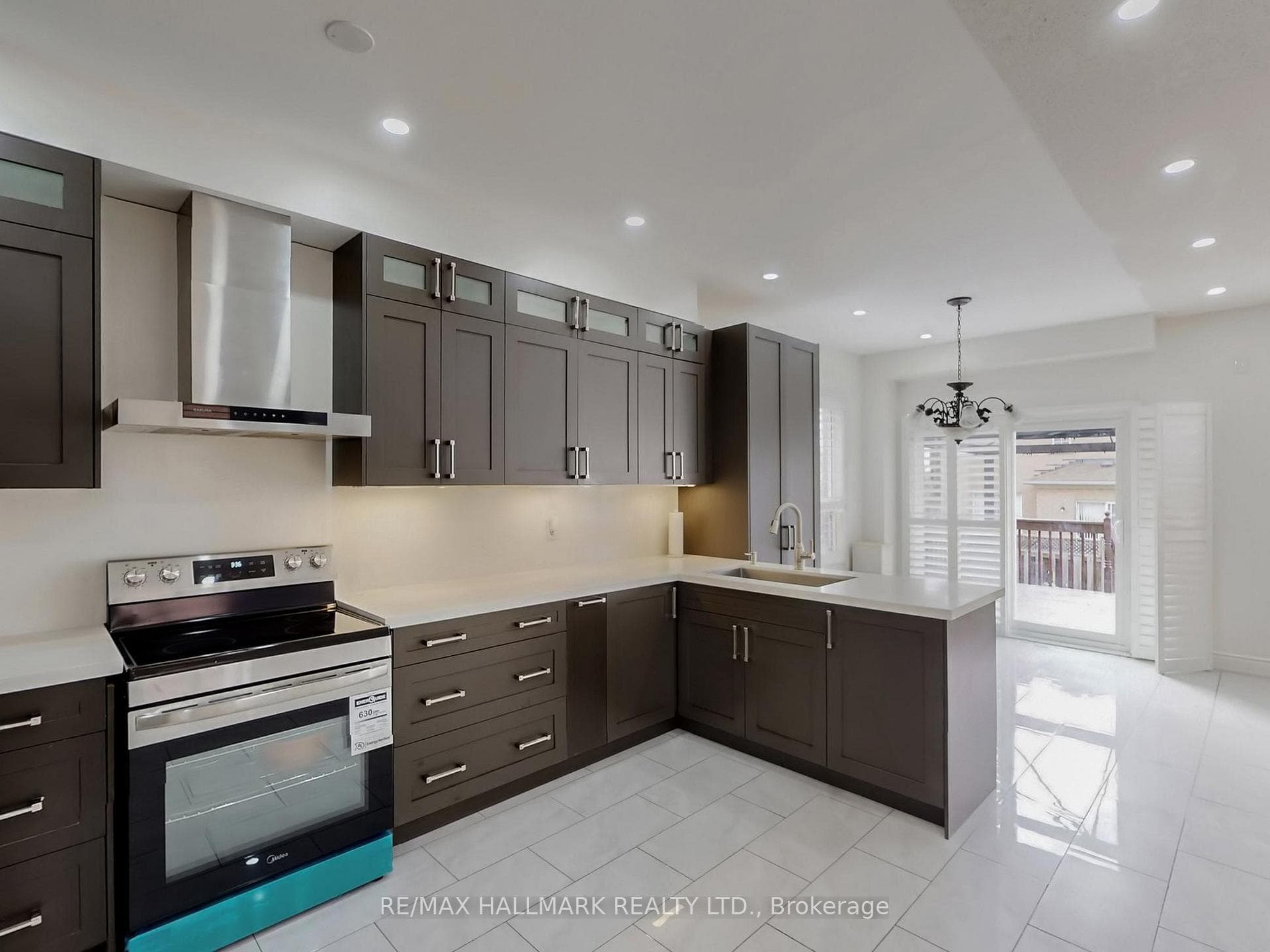 Kitchen with Breakfast Bar and Deck View